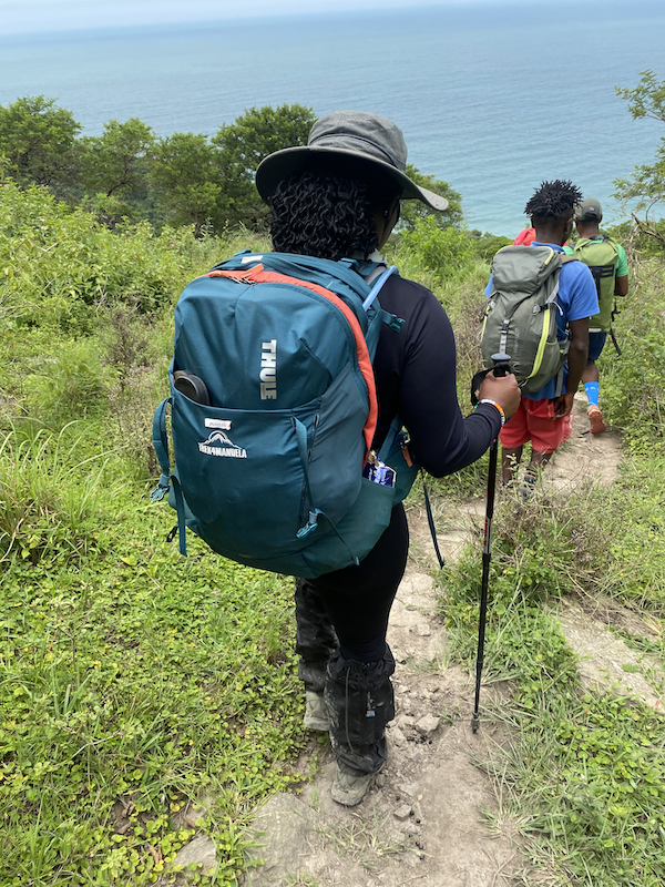 Hiker on a mountain trail in South Africa following trail etiquette
