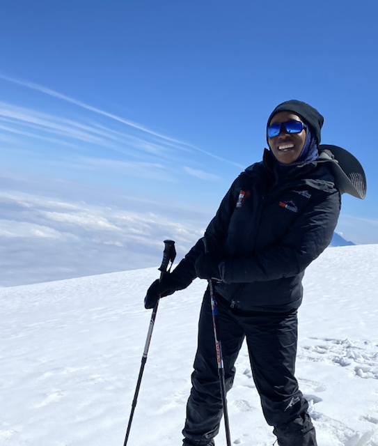 Smiling hiker wintry mountain